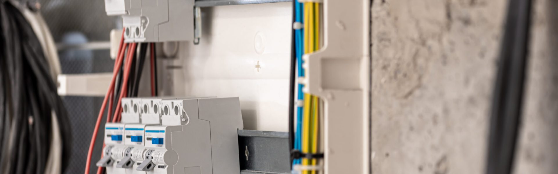 Voltage switchboard with circuit breakers are in the ON and OF positions in the big electric box for electrical distribution panel and temporary electric cables are switched. Electrical background.